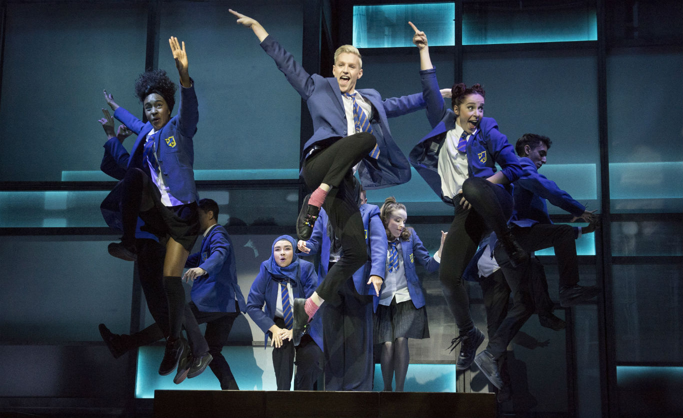 The cast of Everybody's Talking About Jamie leaping into the air